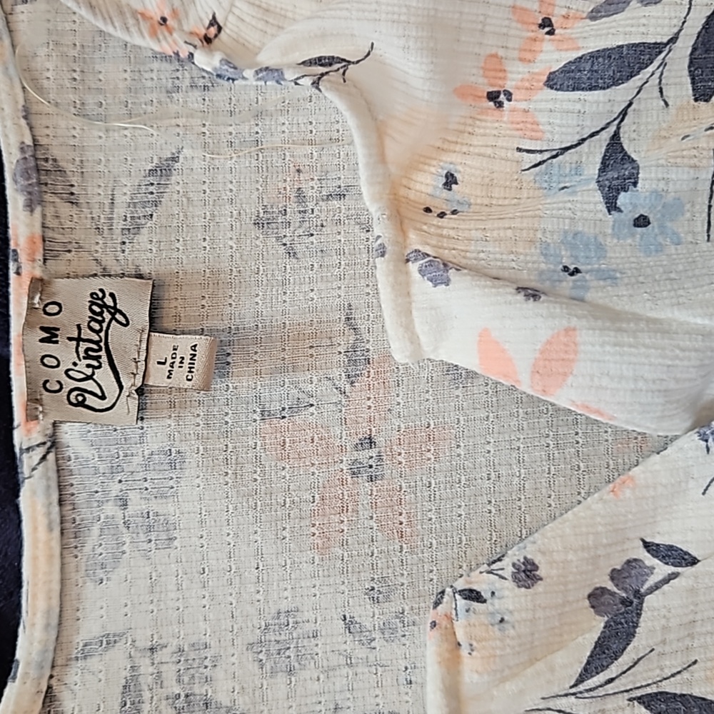 Two womens blouses.  One a medium the other large. One three quarter sleeve.